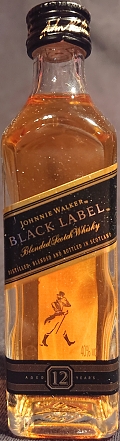 Johnnie Walker
Black Label
Blended Scotch Whisky
Distilled, blended and bottled in Scotland
aged 12 years
Walker & sons, established Kilmarnock 1820
By appointment to Her Majesty The Queen
Scotch whisky distillers
John Walker & sons Limited London
Edinburgh, Scotland
40%